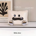 White ceramic tissue box holder with polished glazed finish on coffee table