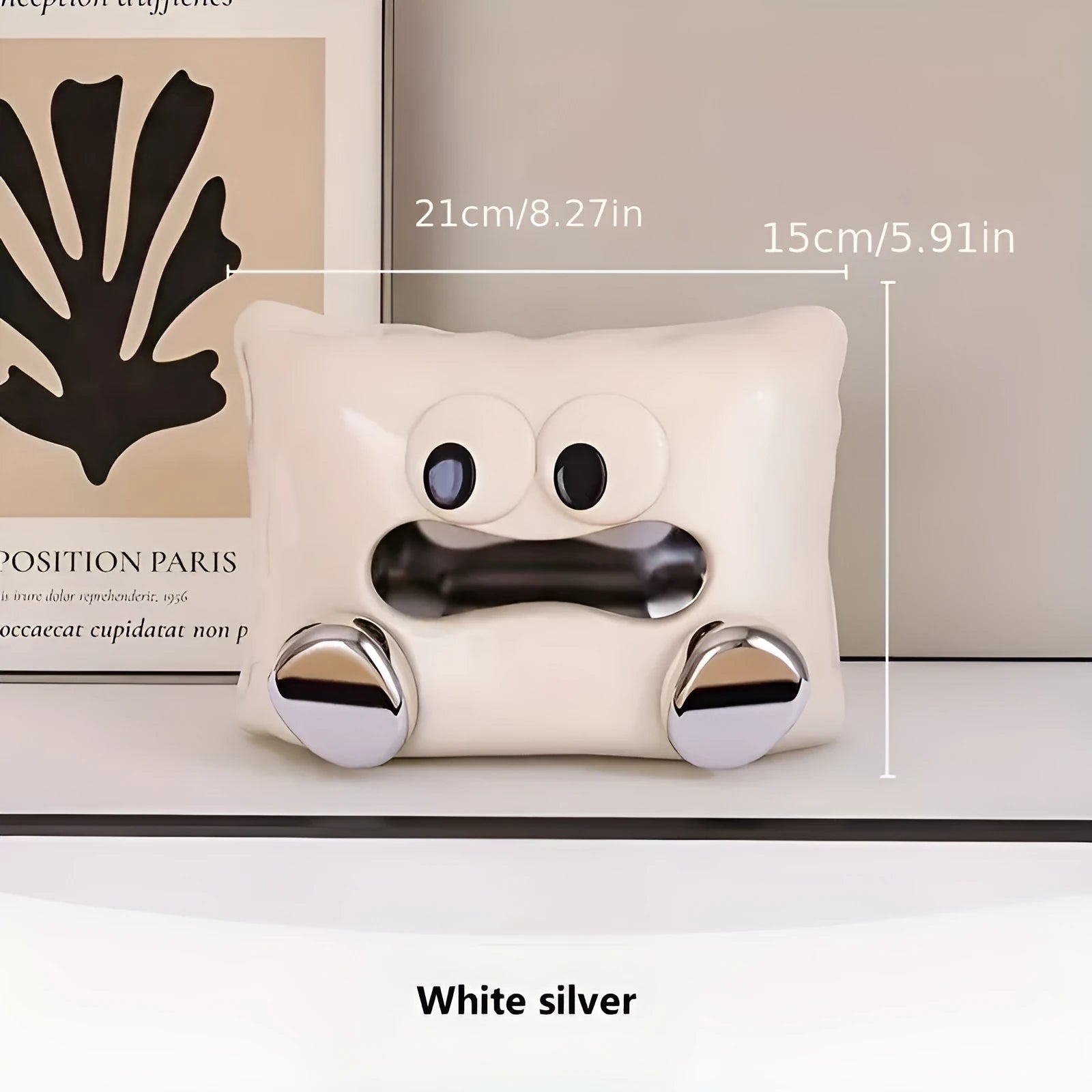 White ceramic tissue box holder with polished glazed finish on coffee table
