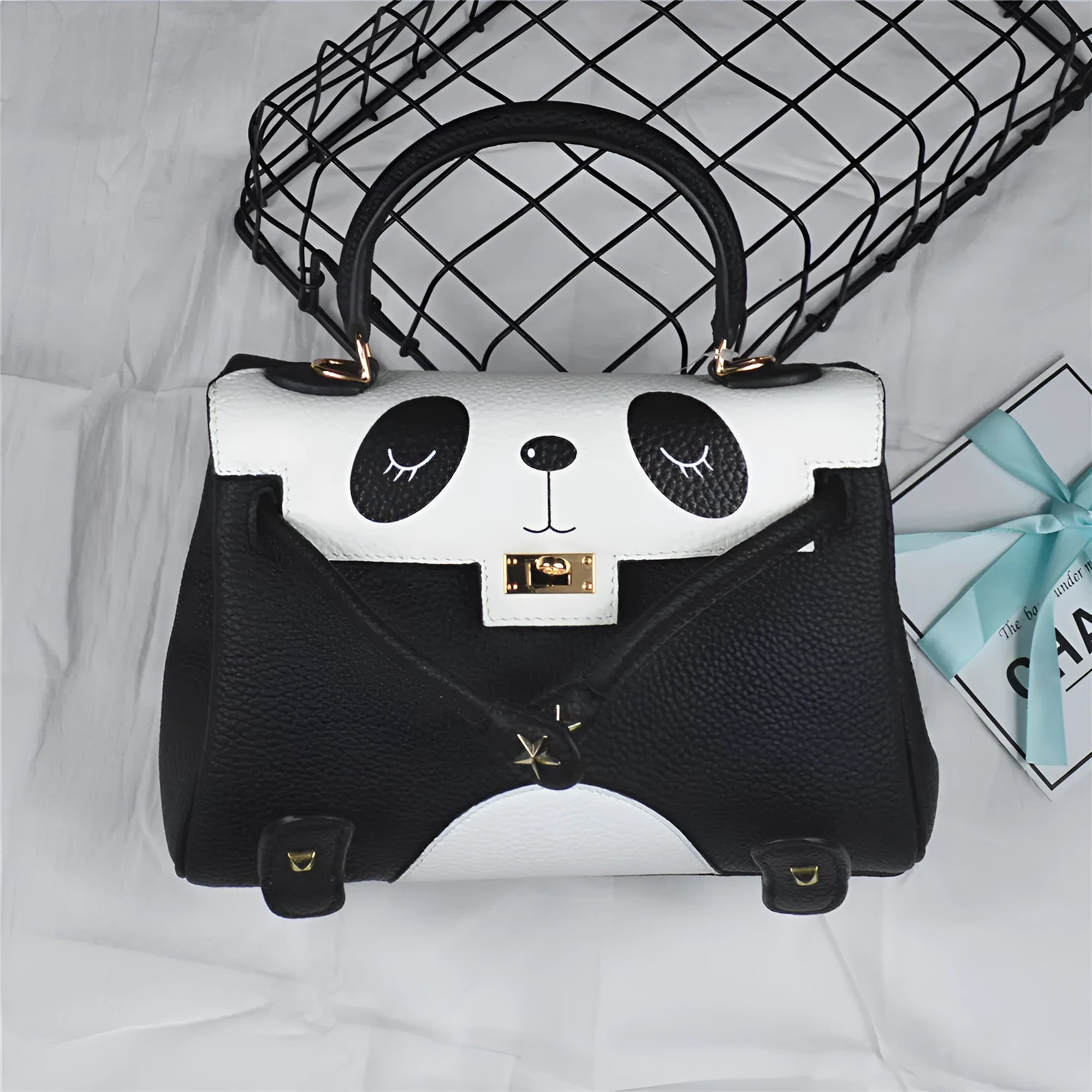 Panda print cow leather handbag in horizontal square shape, shown in two sizes on a neutral background.