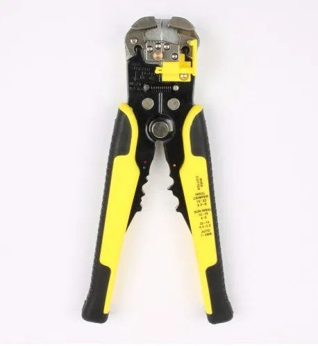 Yellow automatic cable wire stripper and crimping plier tool on a workbench.