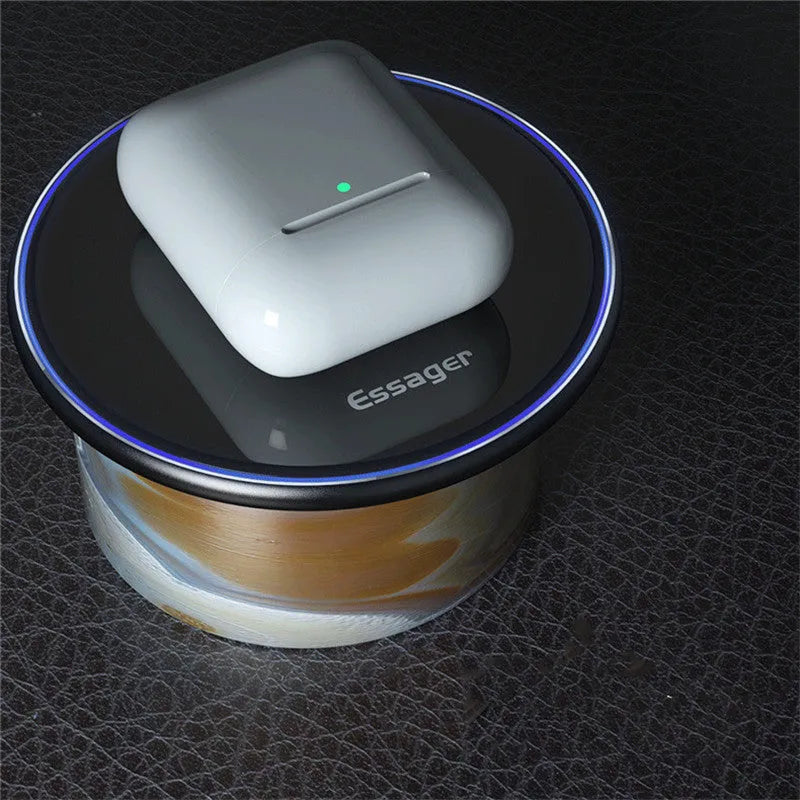 Black aluminium alloy 15W Qi wireless charging pad on a table with LED light.