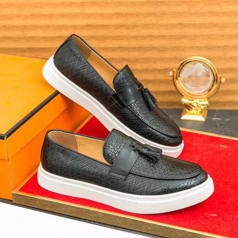 Men's black casual leather shoes with fringe detailing on the upper, round toe, and low heel.