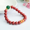 Emperor Sandstone colour cinnabar bracelet with 8mm beads and a six words motto charm.
