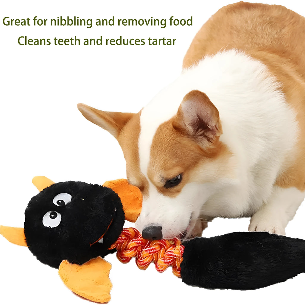 Plush cartoon dog toy with a squeaker and integrated rope knot on a green background.