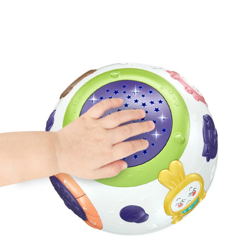 White plastic starry sky night light projector for children on a table.