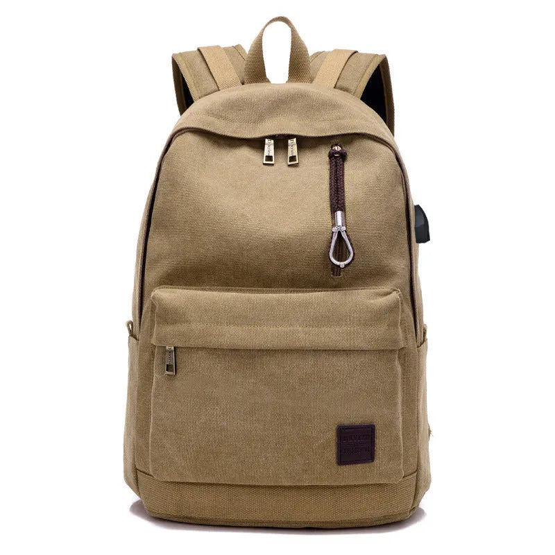 Canvas backpack with USB charging port shown in grey colour, featuring multiple pockets and straps.