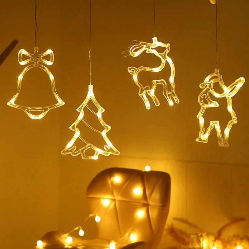 LED suction cup chandelier with Santa Claus, elk, and snowman shapes hanging on a window