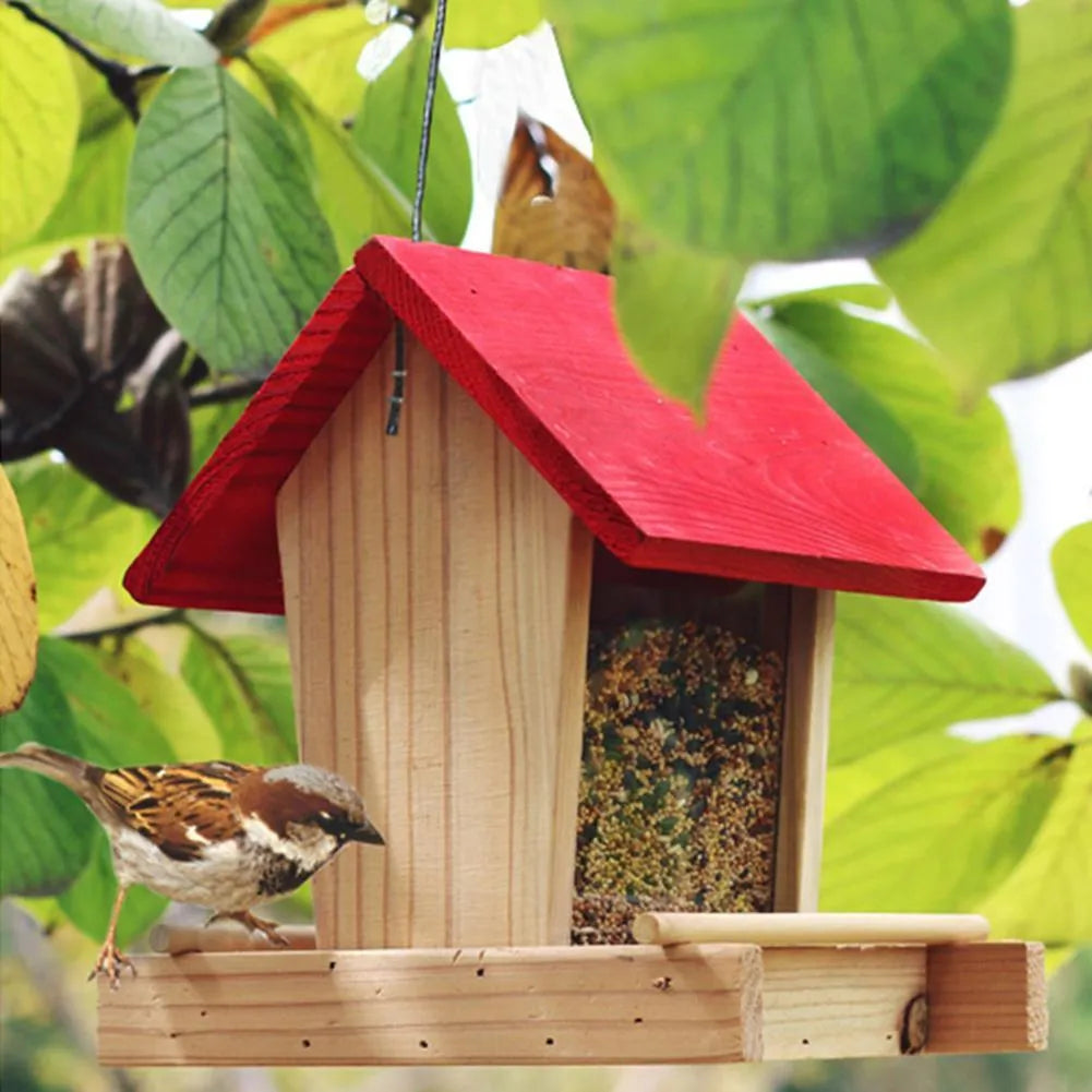 Suspended pine wood bird feeder with a red roof and log texture.