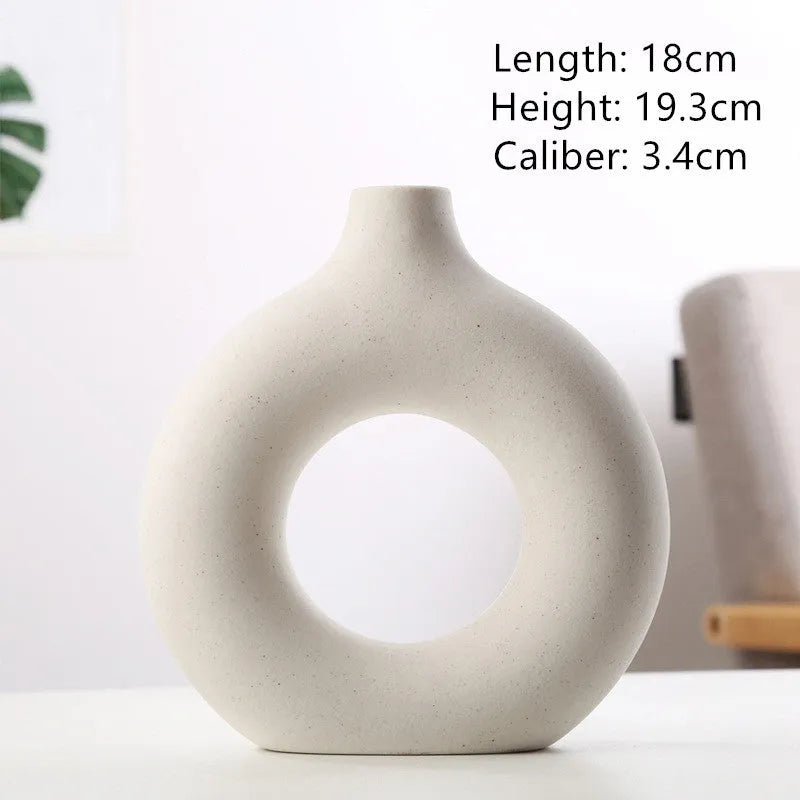 A simple modern frosted porcelain biscuit vase for flower arranging, shown in a neutral colour.