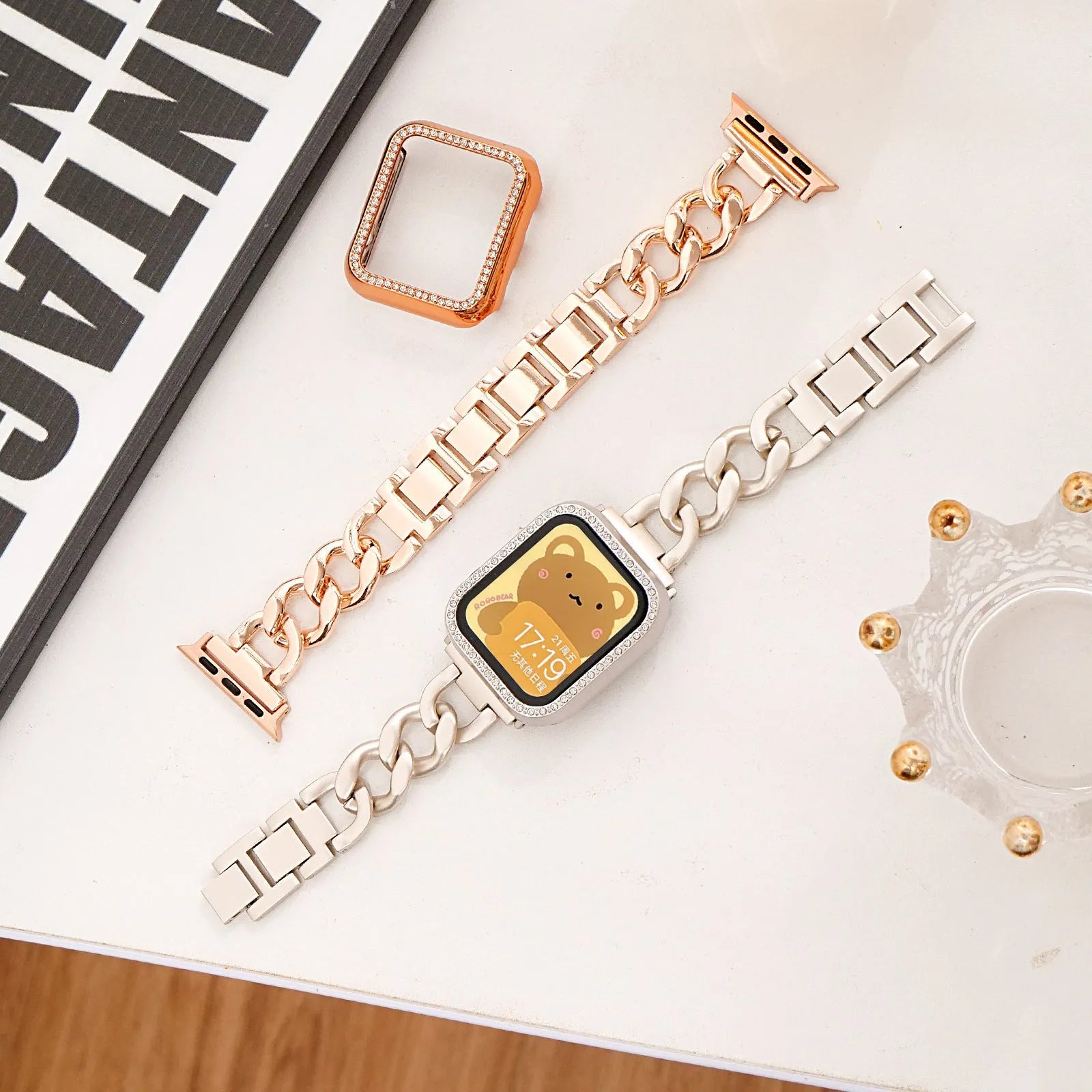 Metal denim chain watch strap for Apple Watch in multiple colours on a grey background.