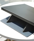 Blue portable laptop cooling bracket showing foldable design with anti-slip surface