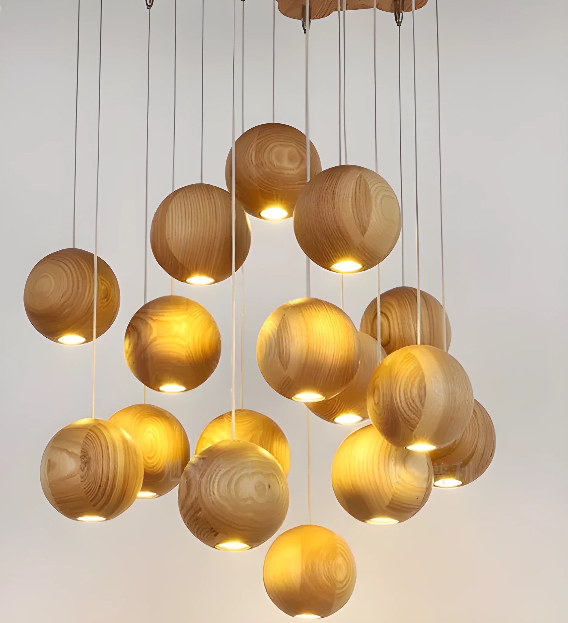 Nordic-style solid wood ball chandelier pendant light with adjustable cord, shown with a wooden disc base.