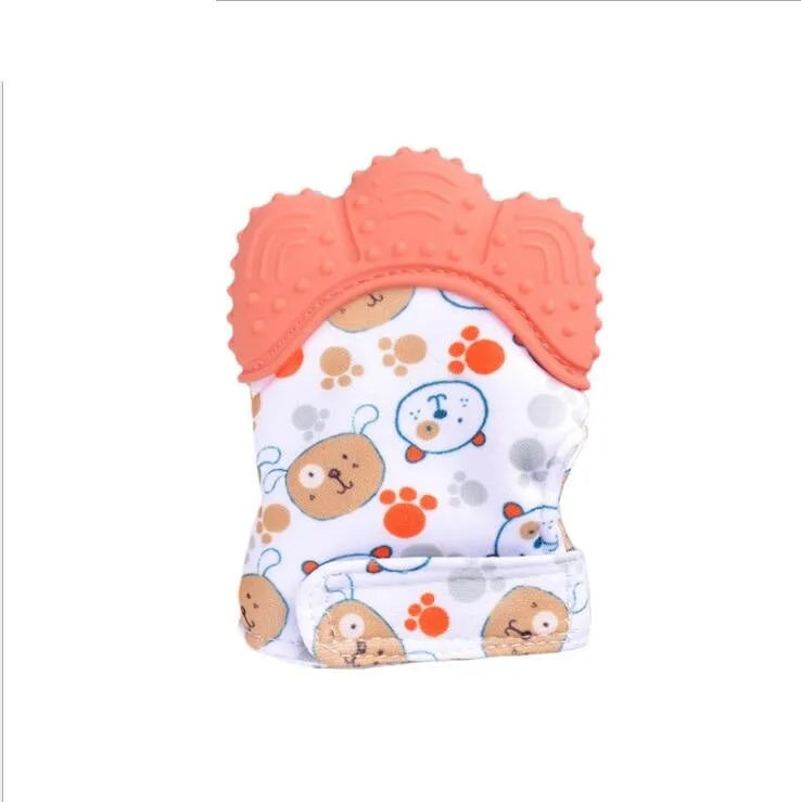 BPA-free silicone baby teether glove fastened with a white Velcro strap on a baby's hand