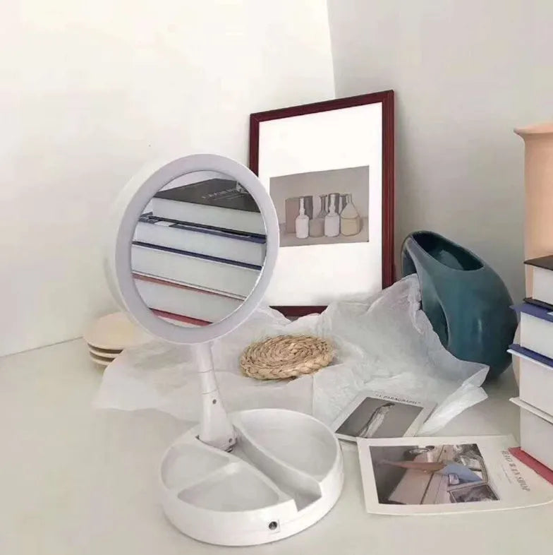 White acrylic LED vanity mirror with foldable design and USB charging port