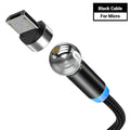 Black magnetic charging cable with spherical connectors showing 360-degree rotation on a table.