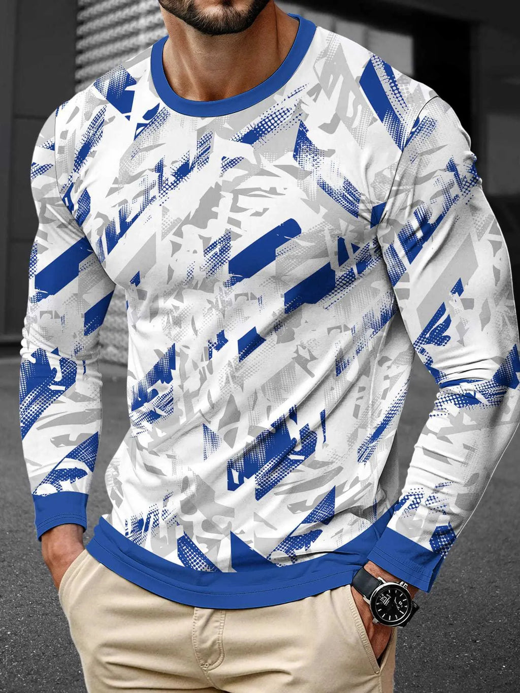 Man wearing a simple grey long sleeve round neck pullover made from milk silk fabric.