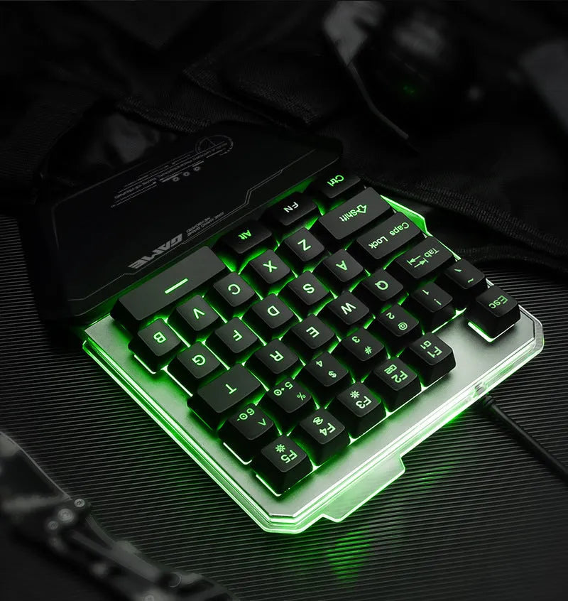 Black Robotic G40 Flow one-handed mechanical keyboard with RGB backlit keys on a desk.