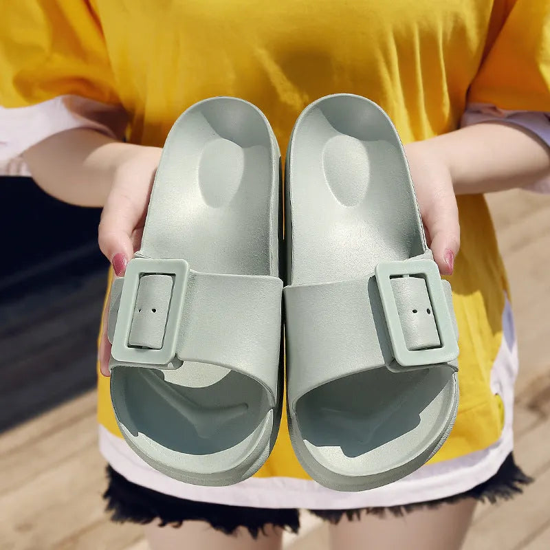 Women's grey blue EVA buckle slipper with a 1.5cm thick sole and adjustable strap.
