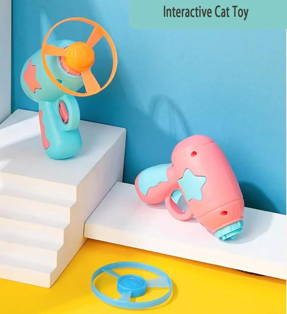 Blue interactive cat toy gun with a plastic frisbee, for indoor cat play.