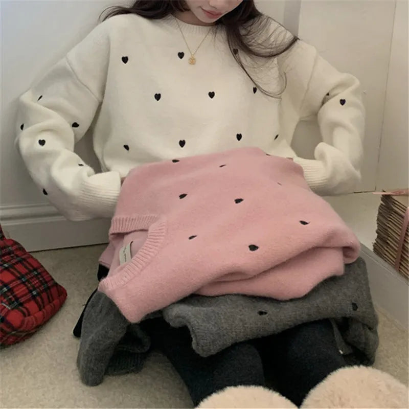 Women's loose acrylic pullover sweater with embroidered love pattern in beige, long sleeves and crew neck.