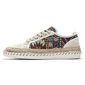 Men's beige and black cloth casual shoes with round toe and colour-block pattern, side view.
