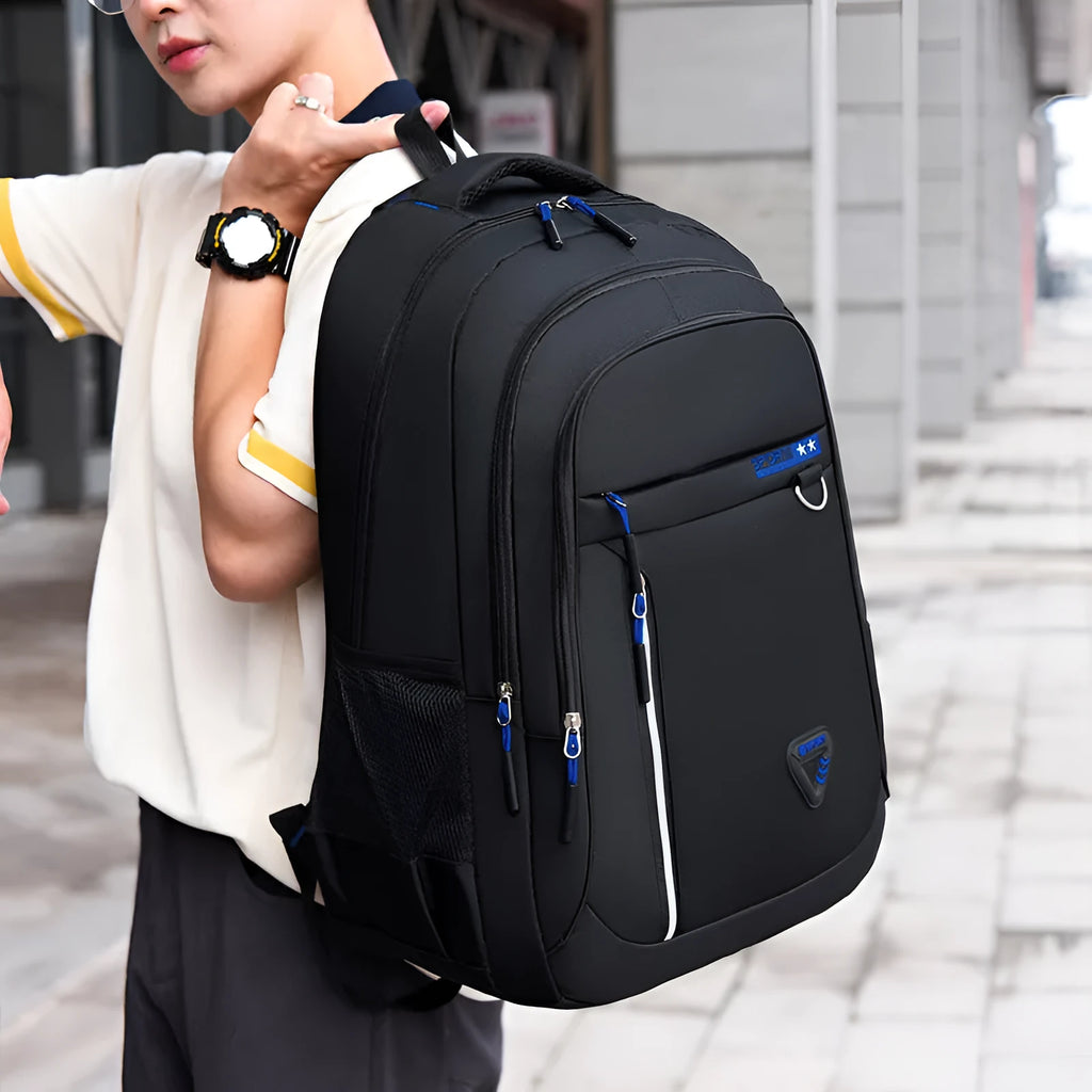 Men's Oxford cloth schoolbag in red with letter pattern, showing air pillow belt burden reduction system