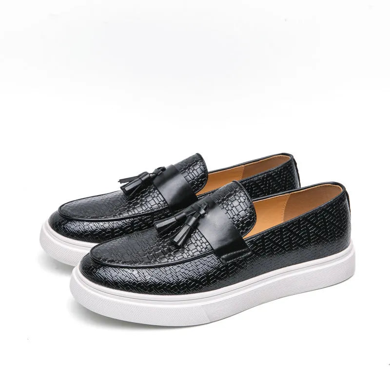 Men's black casual leather shoes with fringe detailing on the upper, round toe, and low heel.