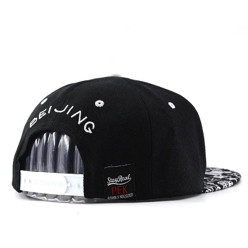SR Black cotton baseball cap with front letter embroidery, showing adjustable snapback strap and dome crown.