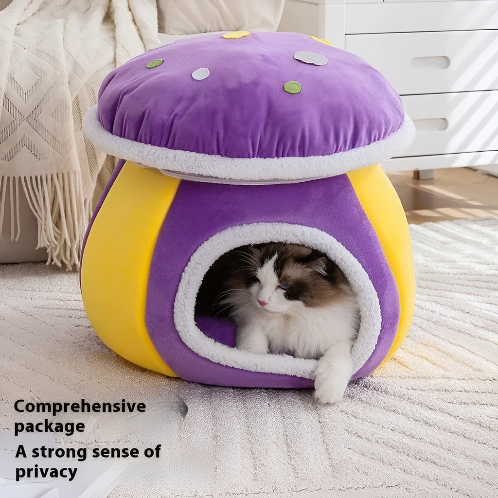 Grey mushroom-shaped enclosed cat bed with plush interior and a detached matching blanket on a wooden floor.