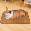 Brown rattan fibre cooling mat for dogs on a floor, showing its woven texture.
