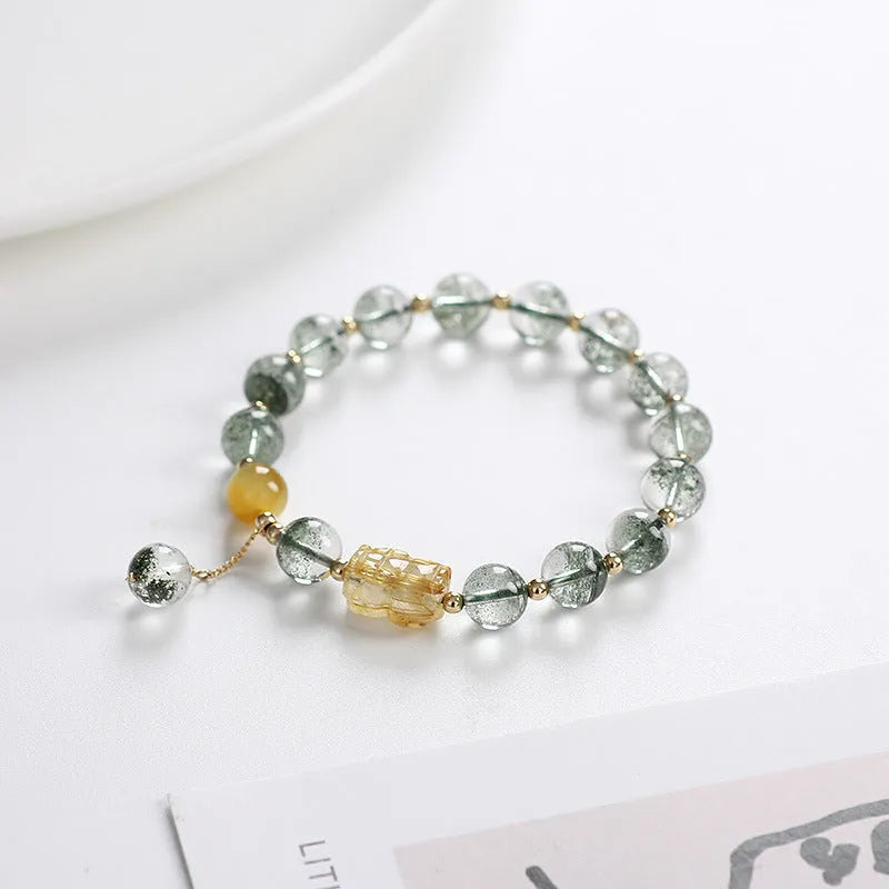 Green phantom quartz crystal bracelet with rutilated inclusions, geometric ethnic design, 8mm diameter