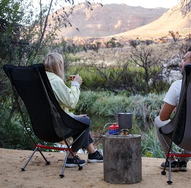 Portable ultralight aluminium camping chair in black with carry bag, folded for transport