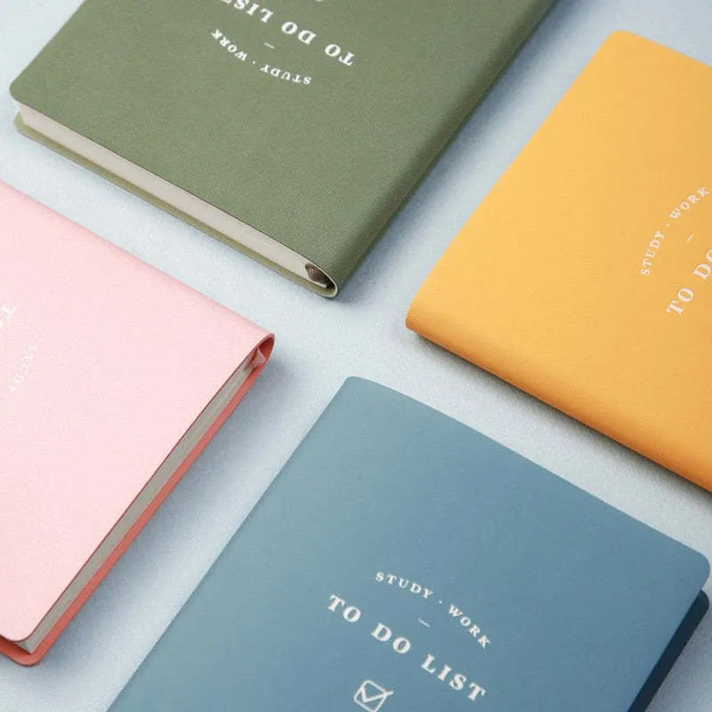 Simple style portable notebook with PU cover in blue, green, pink, or yellow, showing 96 inner pages.