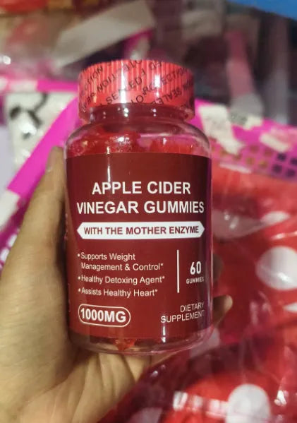 Bottle of apple cider vinegar gummy supplements containing 60 soft candy tablets for adult nutrition