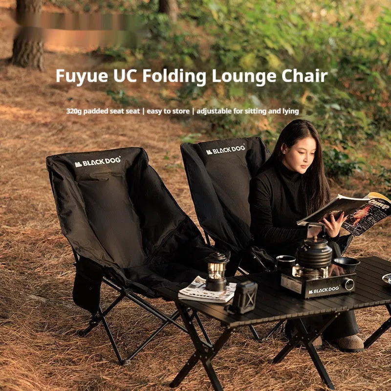 Night Black portable folding moon chair with Oxford cloth upholstery set up outdoors