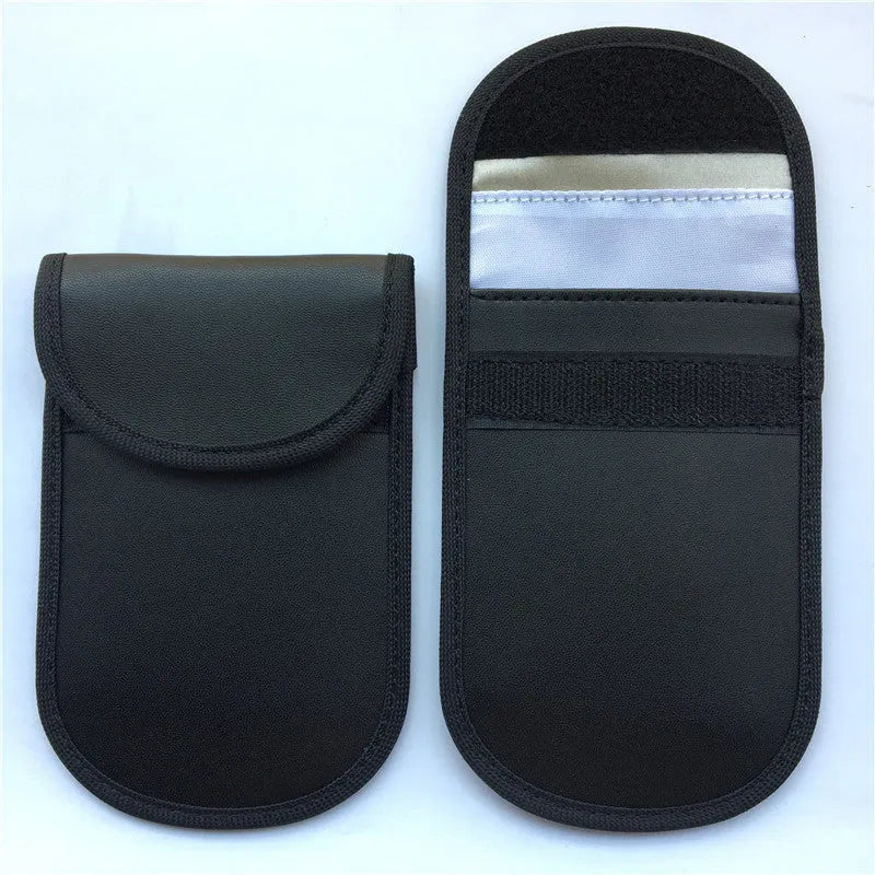 Black signal-blocking Faraday pouch for car key fobs, size 20x10 cm, lying flat on a surface