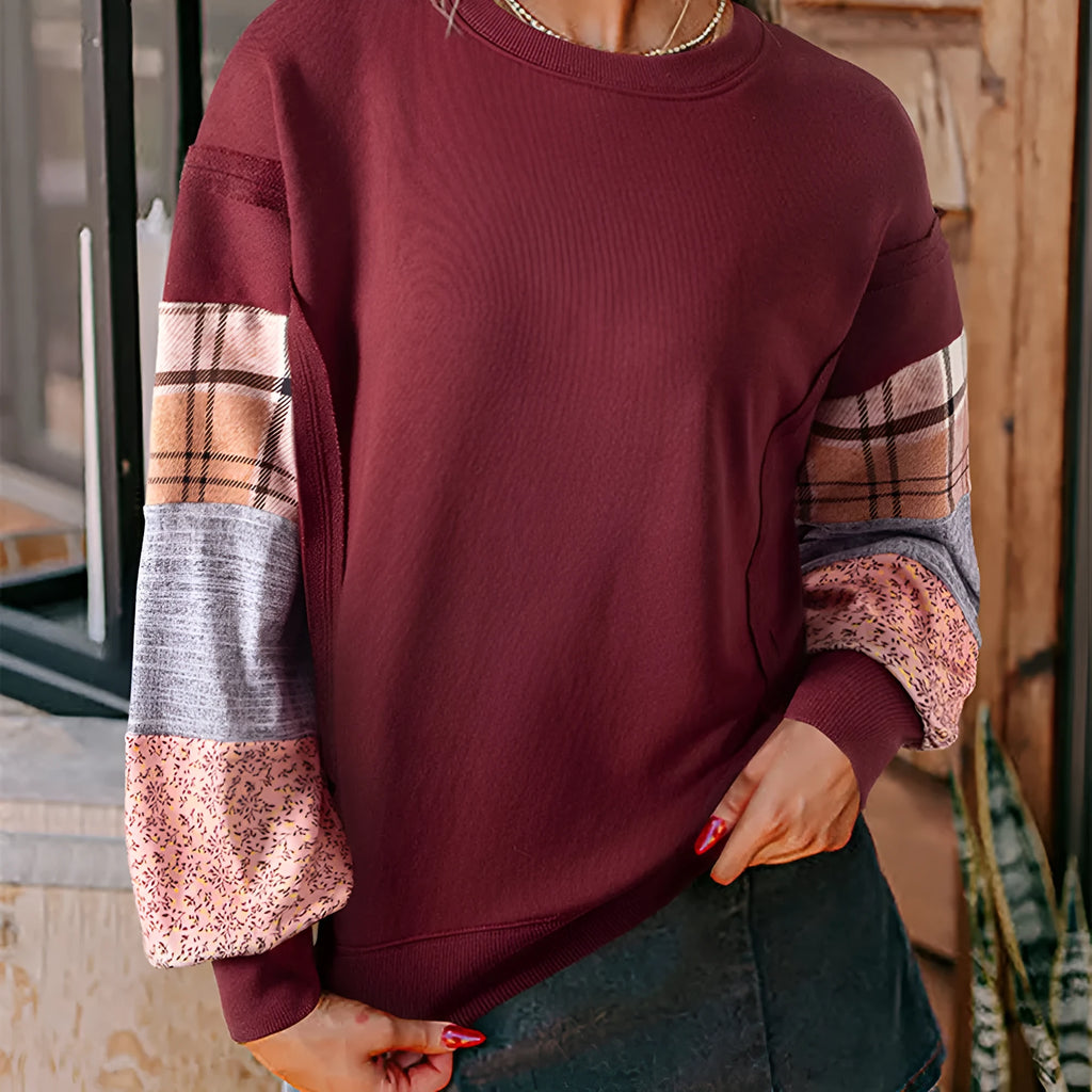 Women's loose fit apricot plaid stitch long sleeve pullover top on hanger.