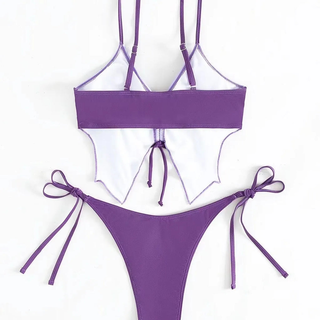 Women's purple bikini set with bow detail and high-leg side split design on briefs