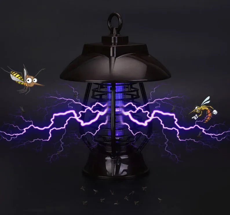 Black solar mosquito lamp with solar panel on top and LED lights for garden insect control