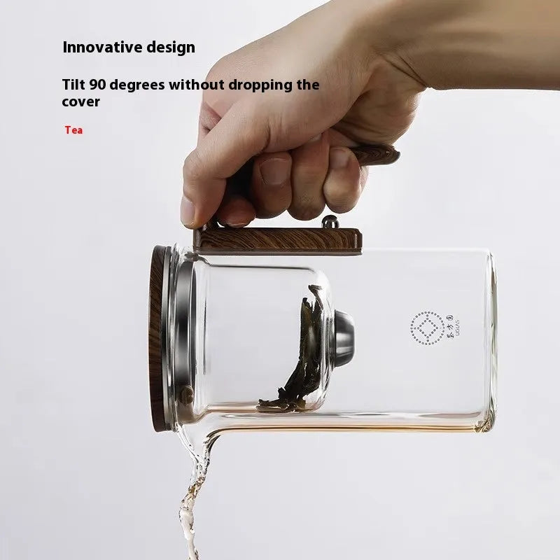 Glass teapot with magnetic separation button, walnut wood handle, and Chinese style design on tea tray