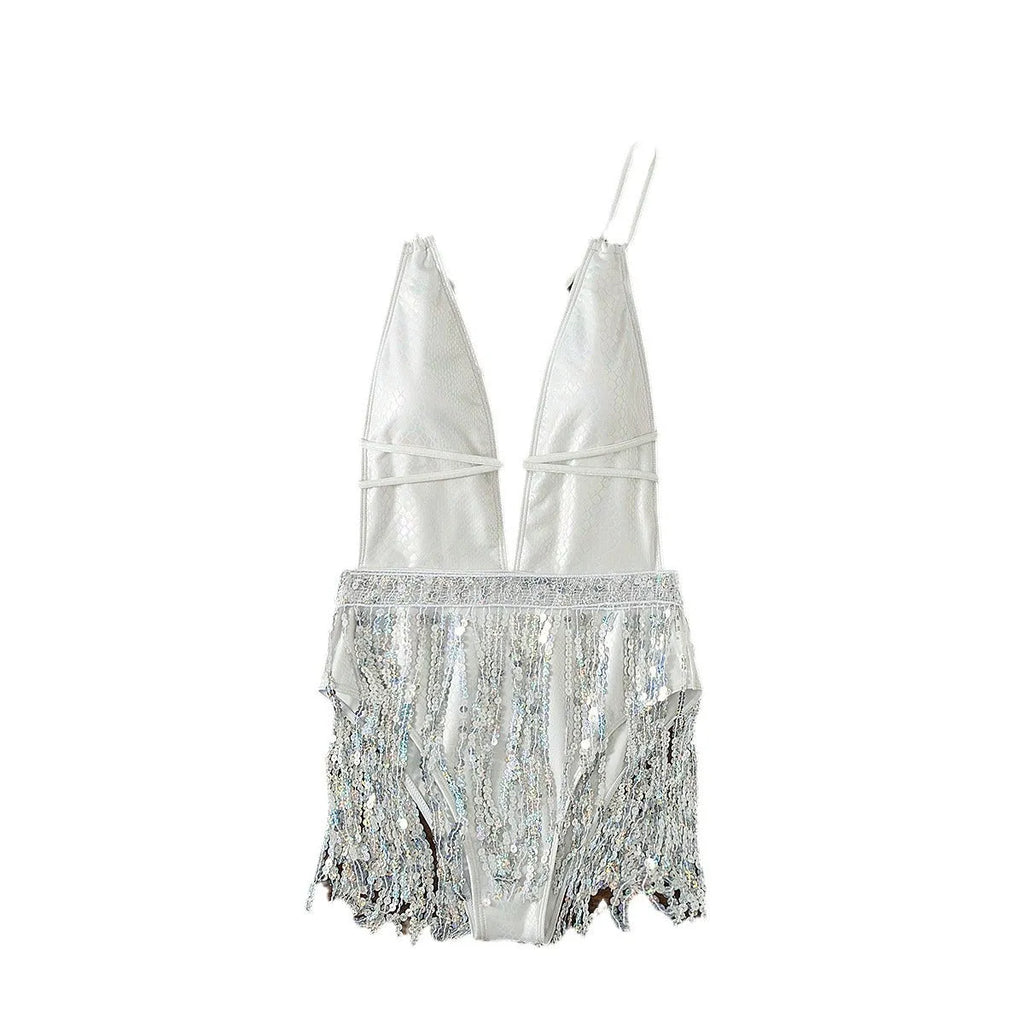 White one-piece swimsuit with deep V neckline and tassel detail on model