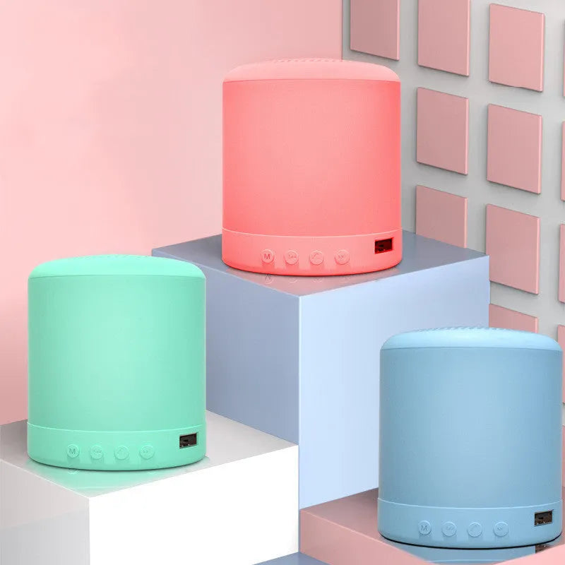 A11 compact wireless subwoofer speaker in black, pink, blue, or green colours