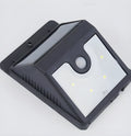 Two white outdoor solar LED security lights with four LEDs each, mounted on a wall bracket.