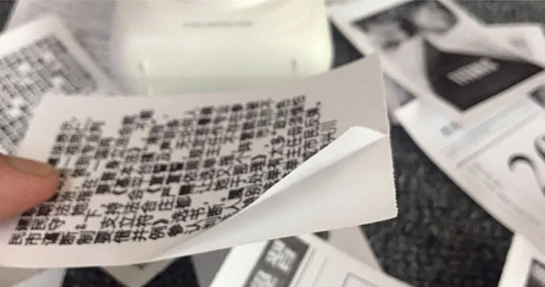 PerPage mini wireless portable thermal printer paper roll in multiple colours, showing label and sticker options