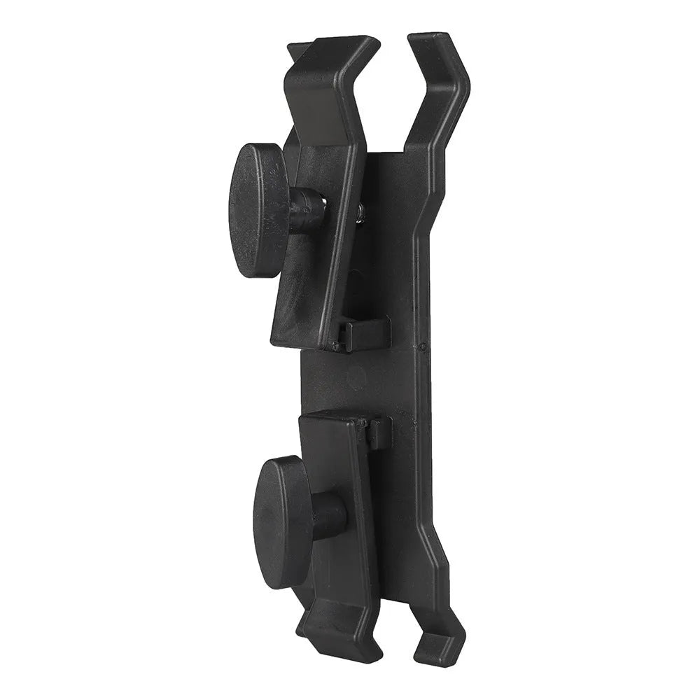 Black plastic umbrella clip attached to a tripod leg, holding a folded umbrella.