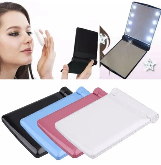 Folding LED pocket cosmetic mirror in black with built-in light, closed position