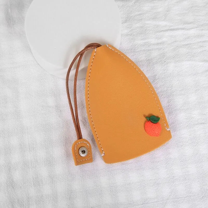 Colourful cartoon PU leather pull-out key case for car keys, shown open and closed