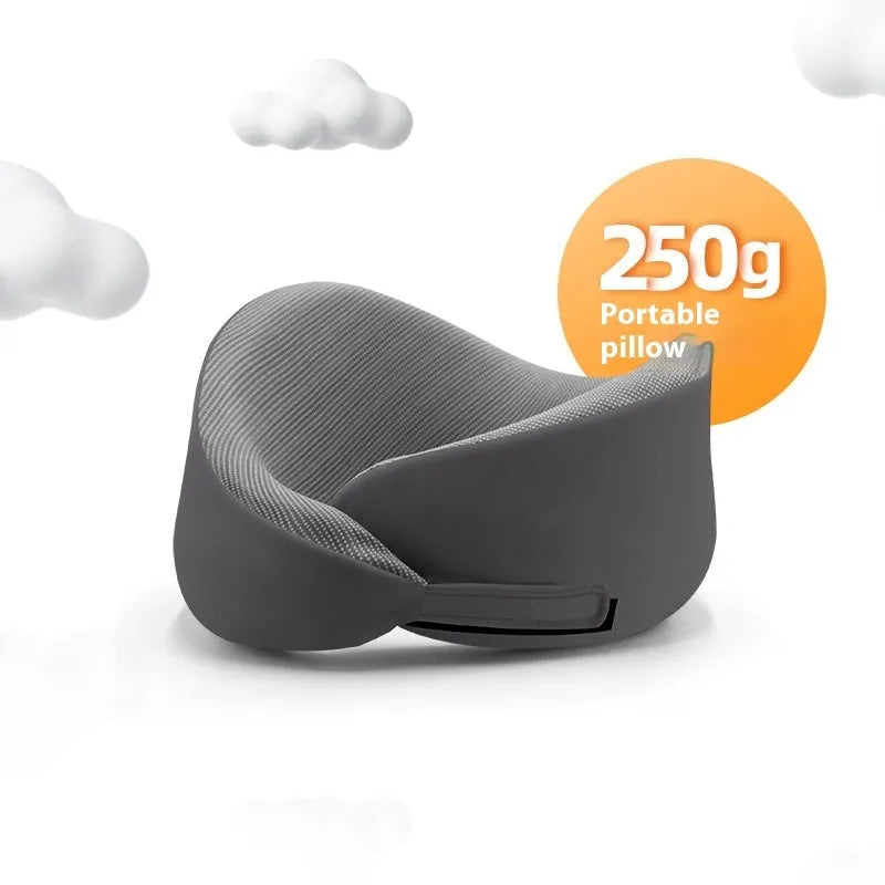 Light grey U-shaped memory foam neck pillow on a white background.