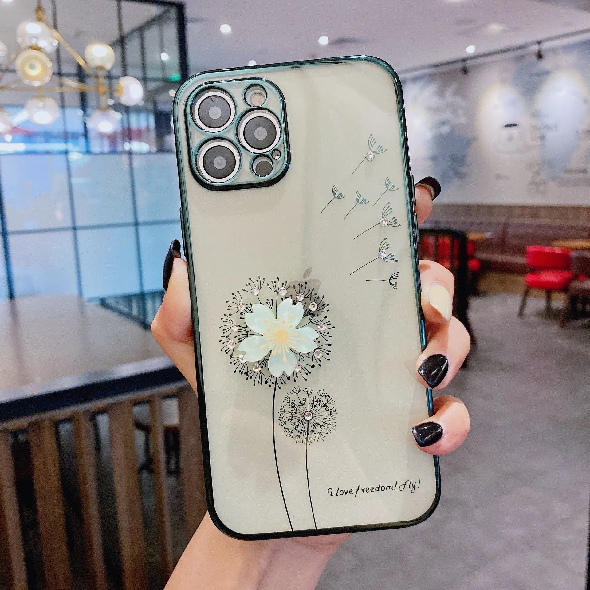 Green iPhone case with 3D white floral design and a silver rotating kickstand extended at the back.