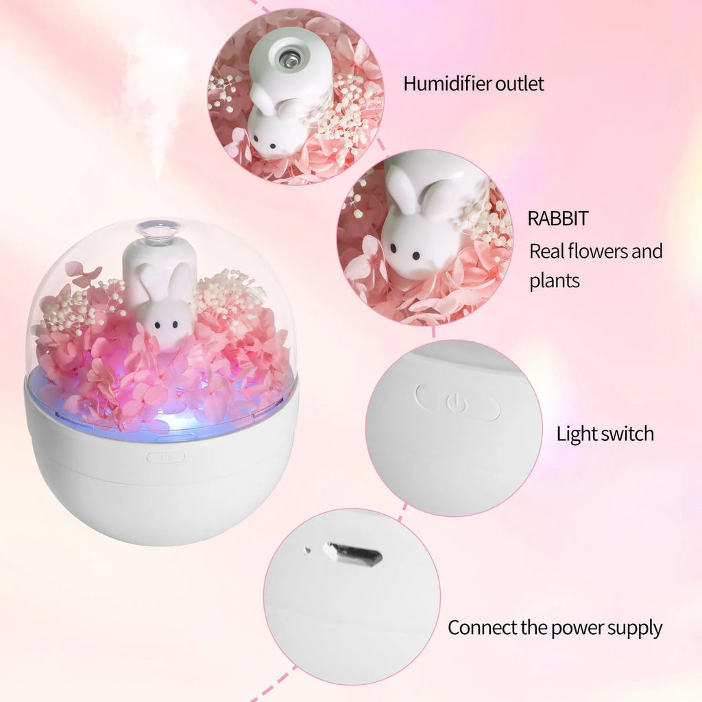 Pink ceramic rabbit vase with preserved flowers, functioning as an ultrasonic aromatherapy humidifier.